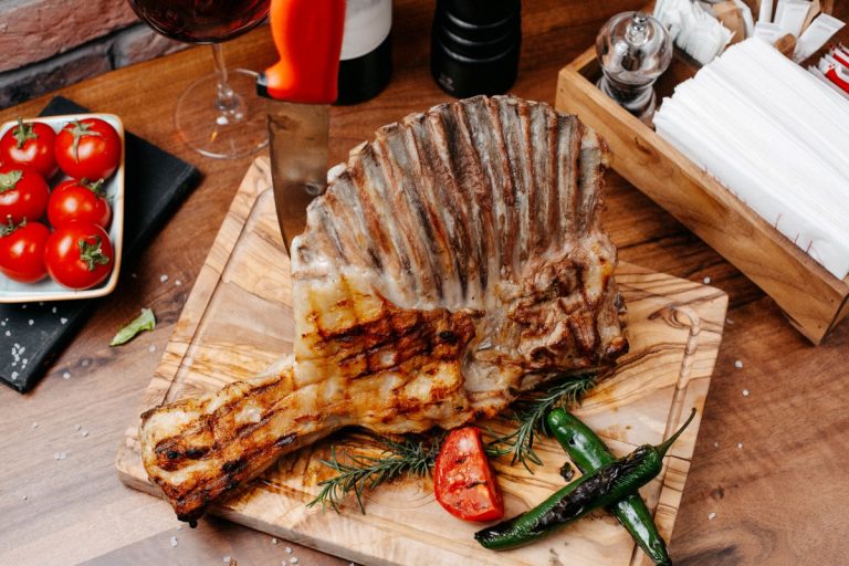 top-view-grilled-ribs-served-with-vegetables-wooden-board (1)